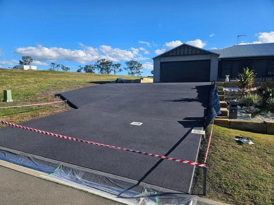 A Driveway Is Being Built in Front of A House — SRS Concreting in Gatton, QLD