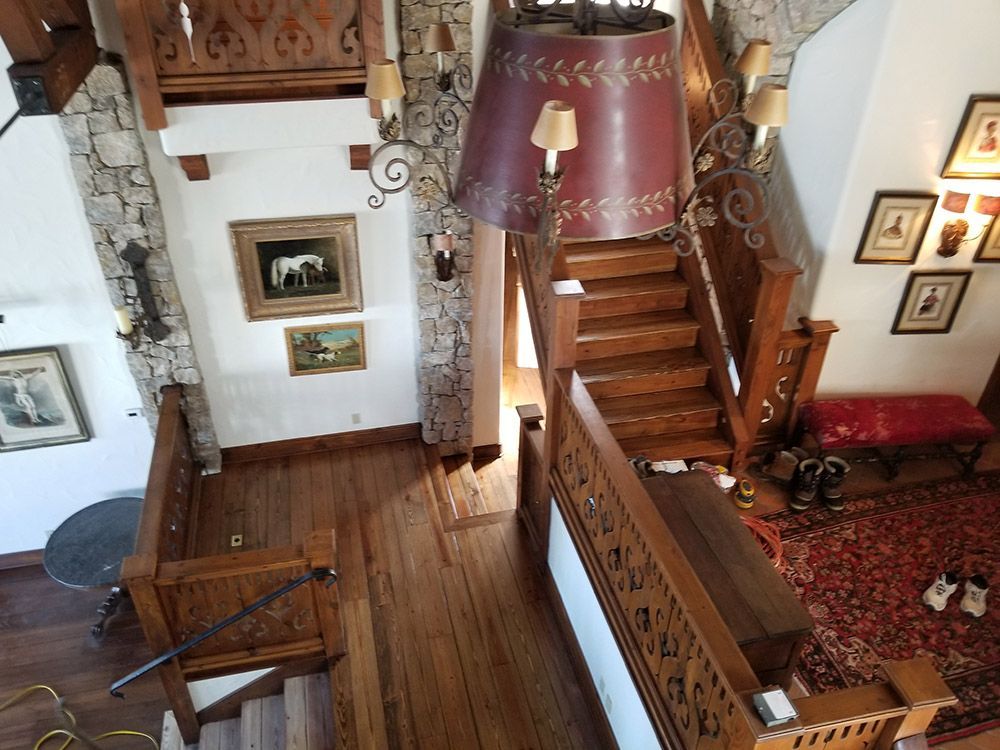 An aerial view of a wooden staircase in a house