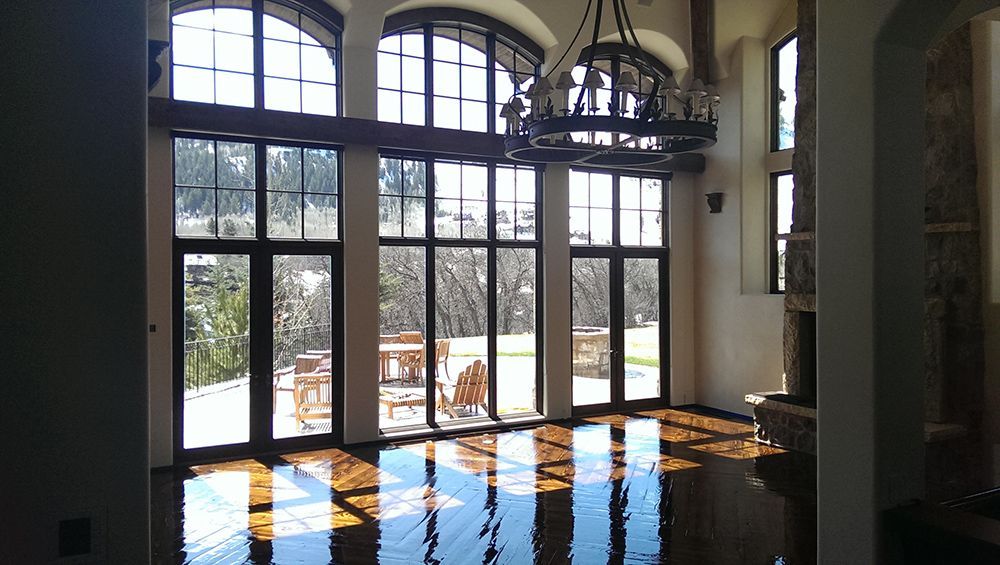 A large room with lots of windows and a chandelier