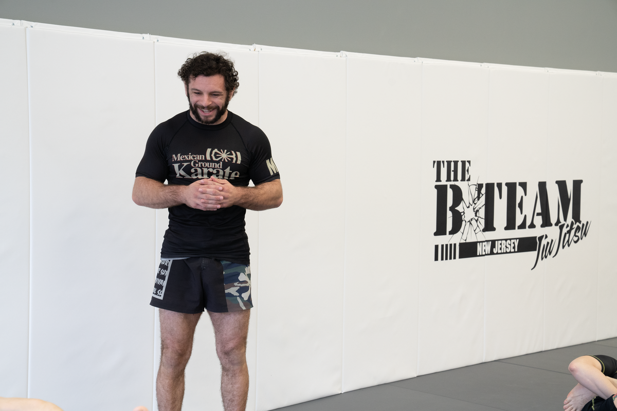 Adults training grappling and controlled breathing at All in Jiu-Jitsu in Green Brook, NJ for stress relief.
