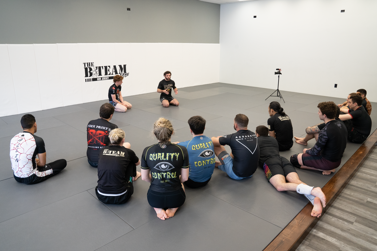 Beginners drilling guard and escape basics at All in Jiu-Jitsu in Green Brook, NJ.