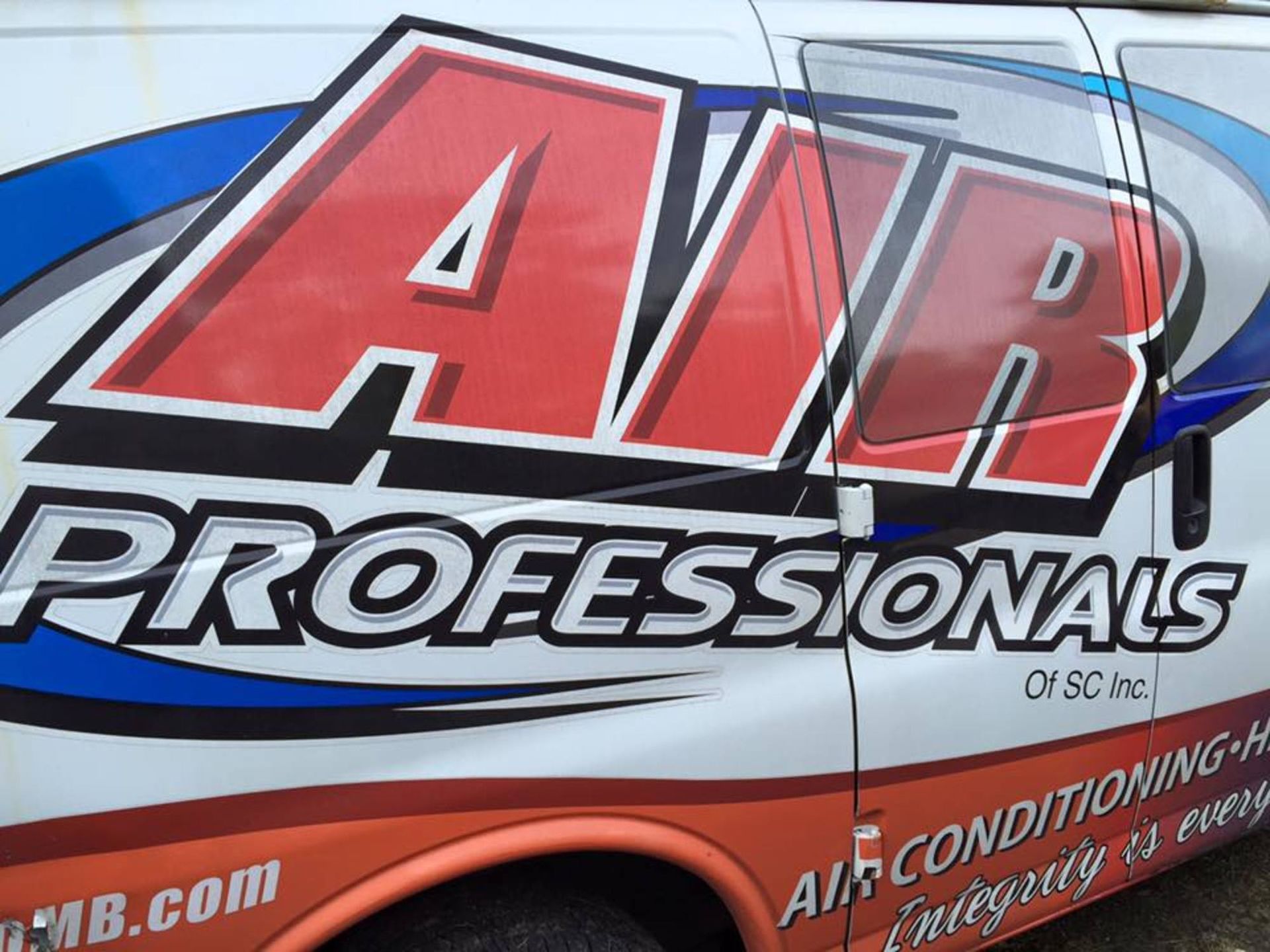 A white van with the word professionals on it