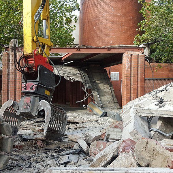 demolition equipment next to a building