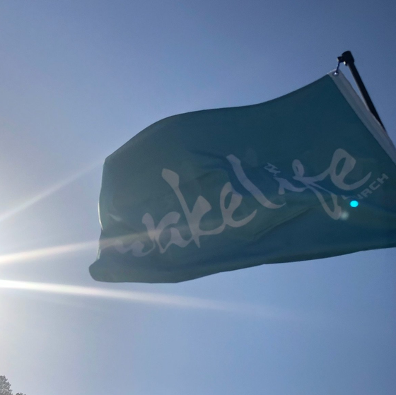 A green flag with the word takelife on it