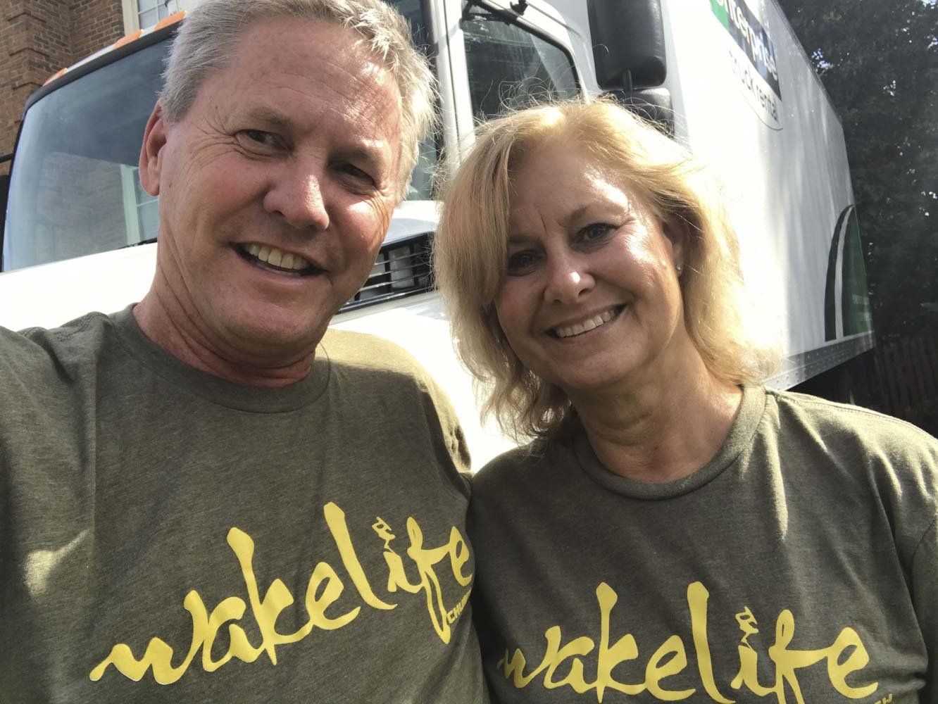 A man and a woman wearing wakelife shirts