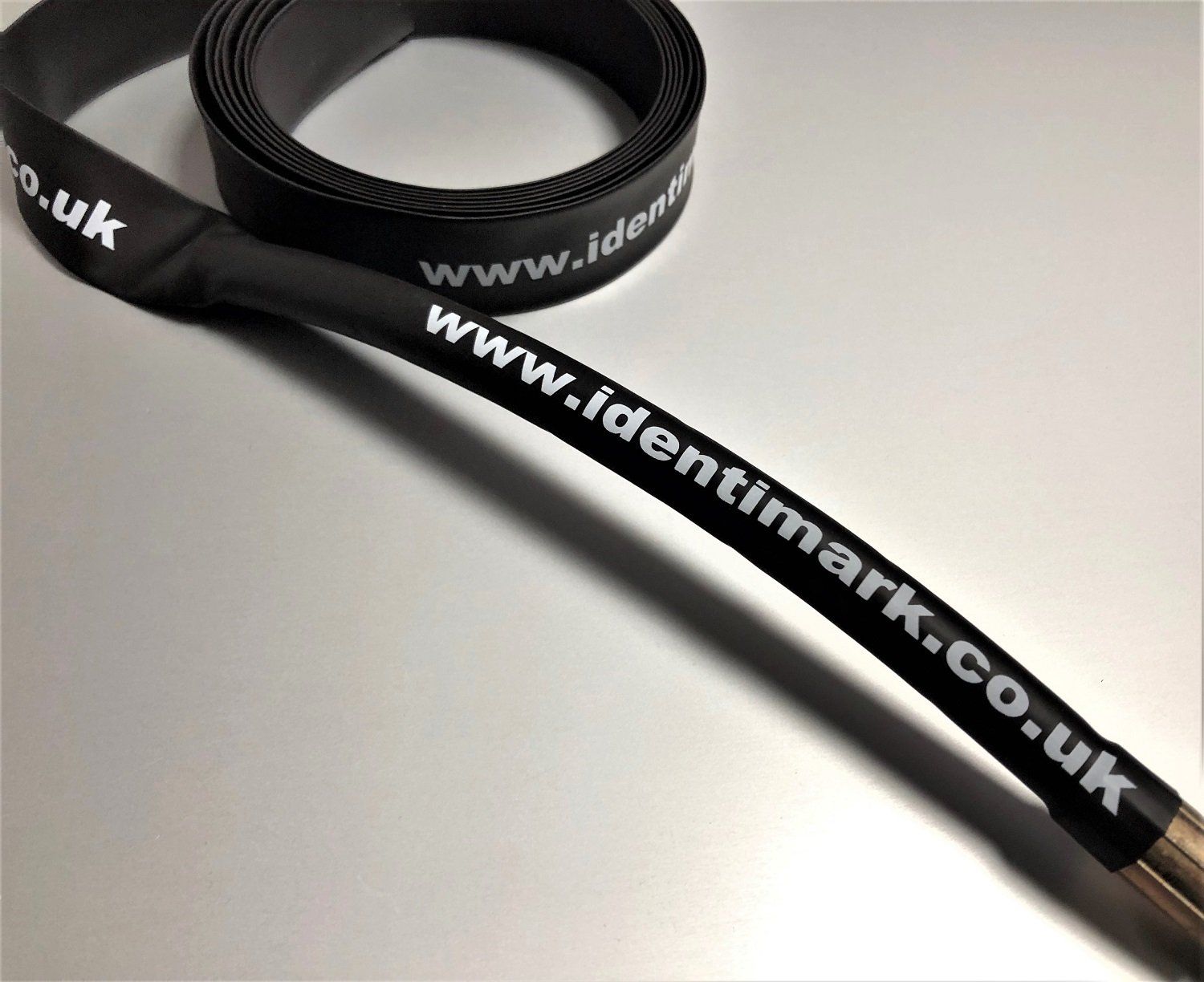Identimark black heatshrink printed in white