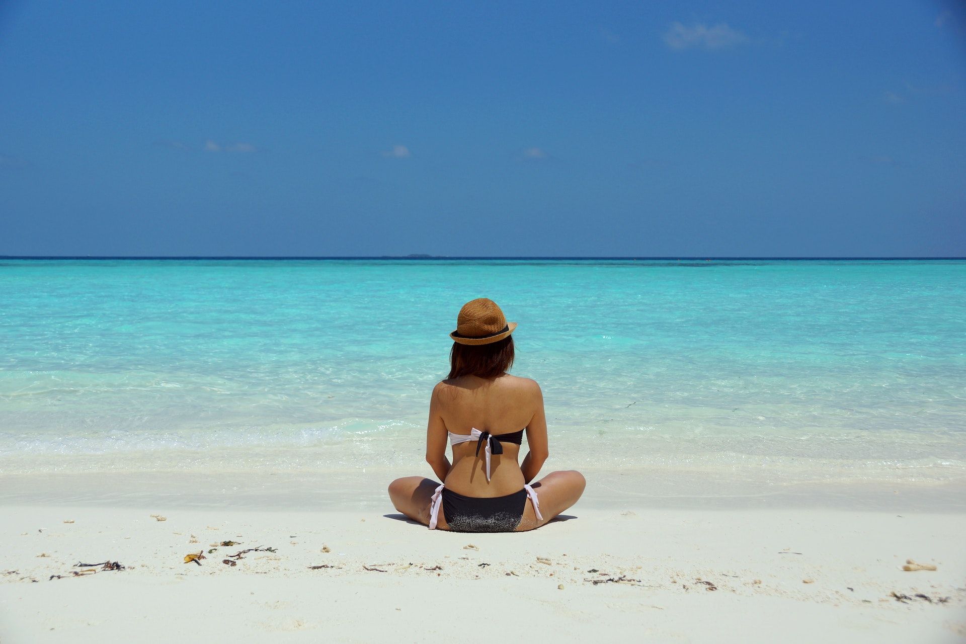 woman sitting on beach