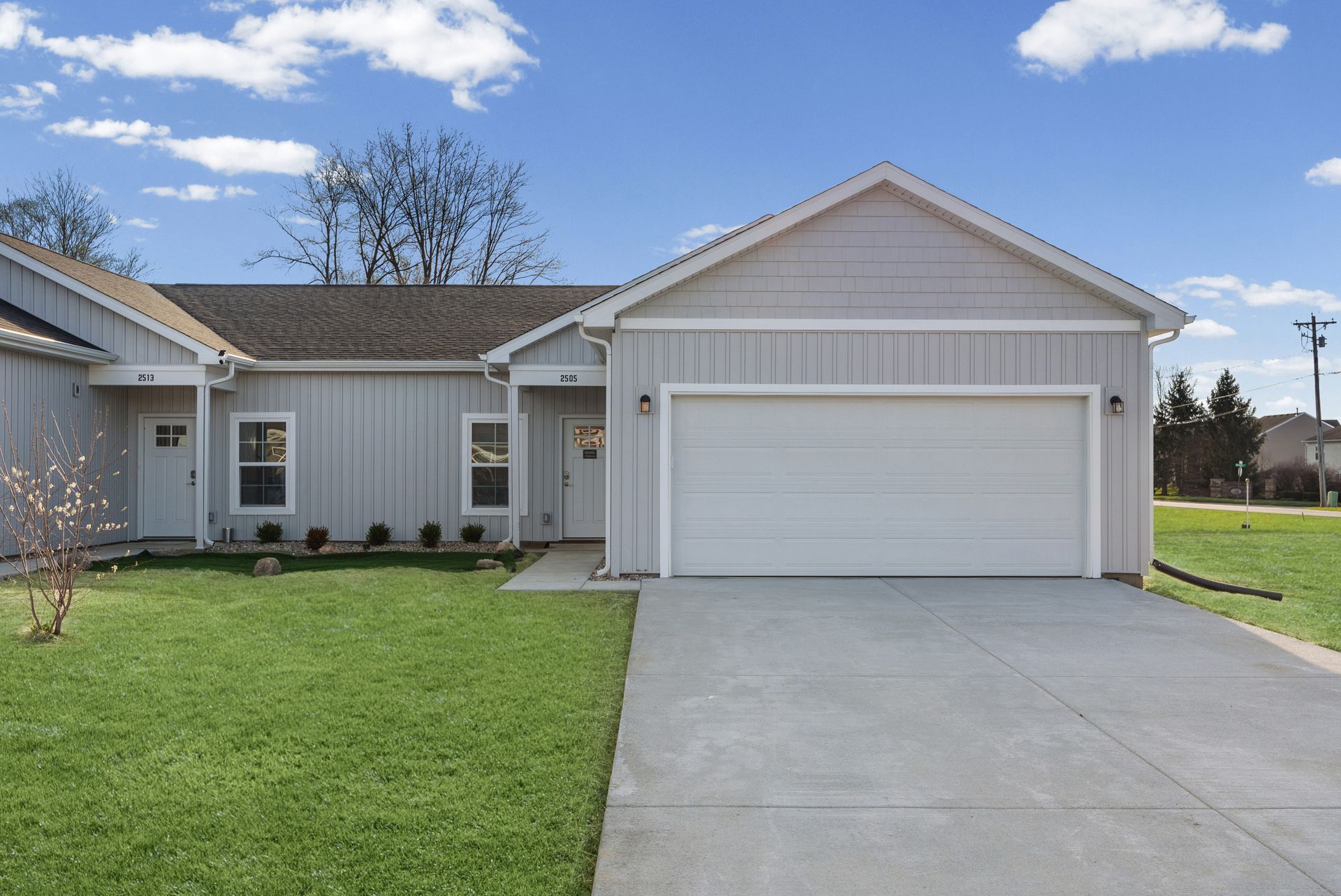 Beautiful exterior with private driveway and attached 2-car garage