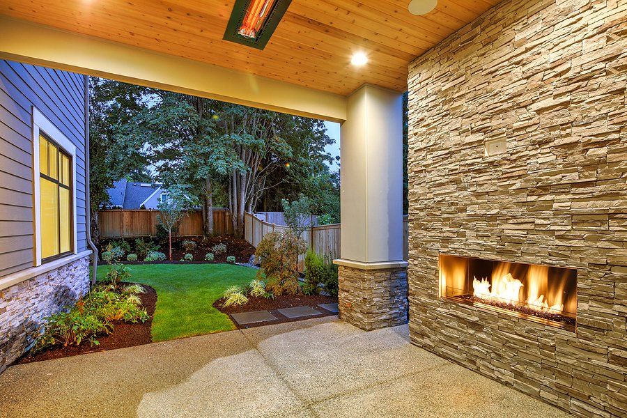 an outdoor area with fireplace