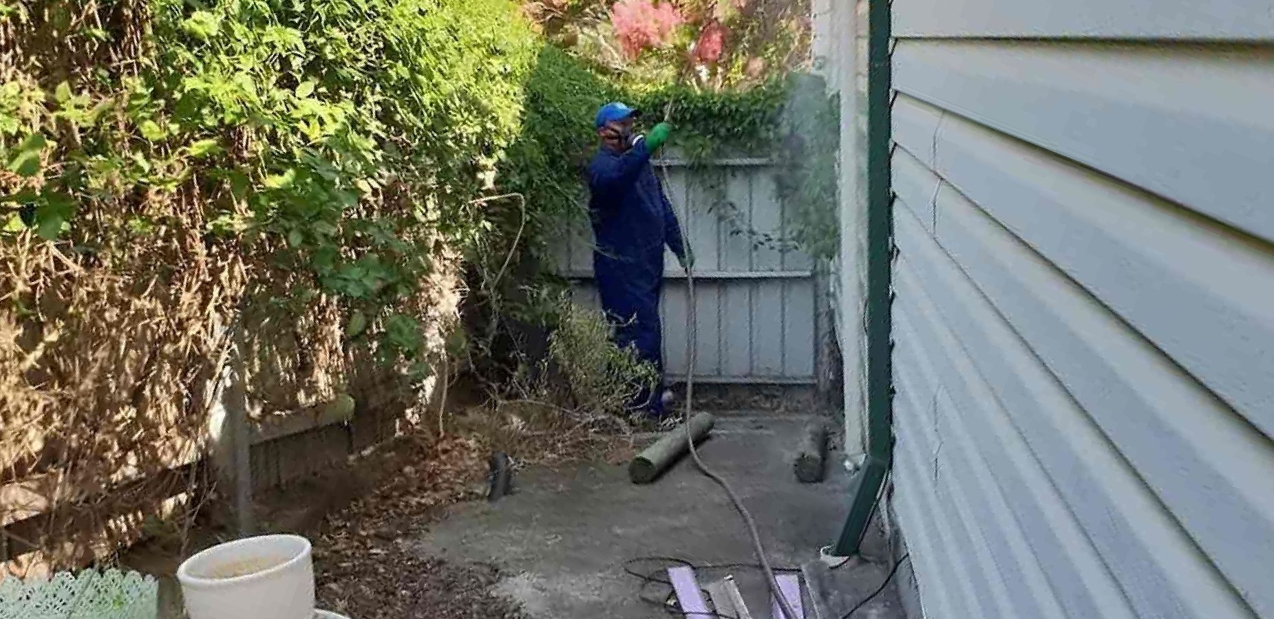 An Empty Room With A Kitchen And A Window — Dan's Pest Control in Albion Park, NSW