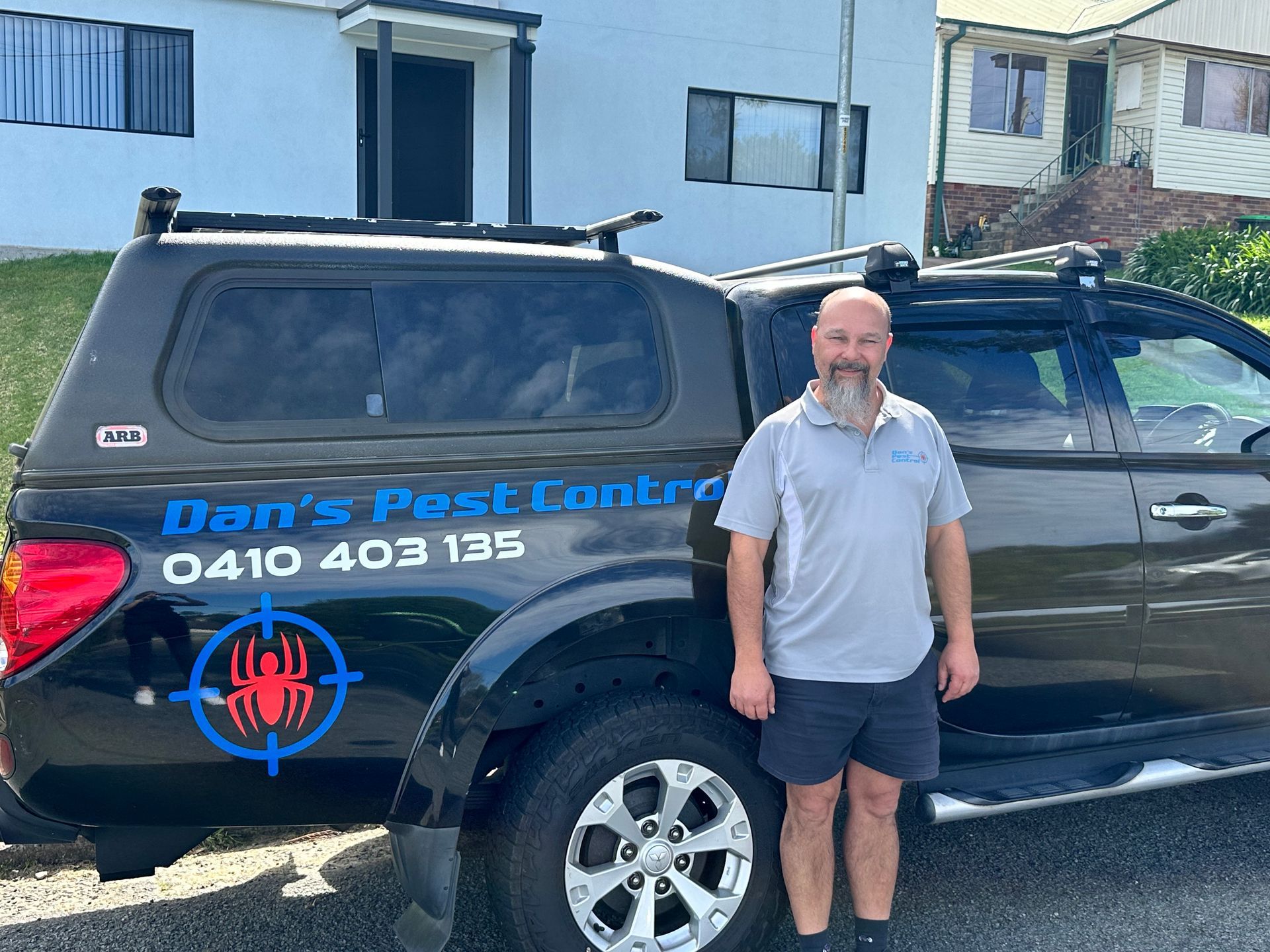 Hand With A Magnifying Glass — Dan’s Pest Control  in Woonona, NSW