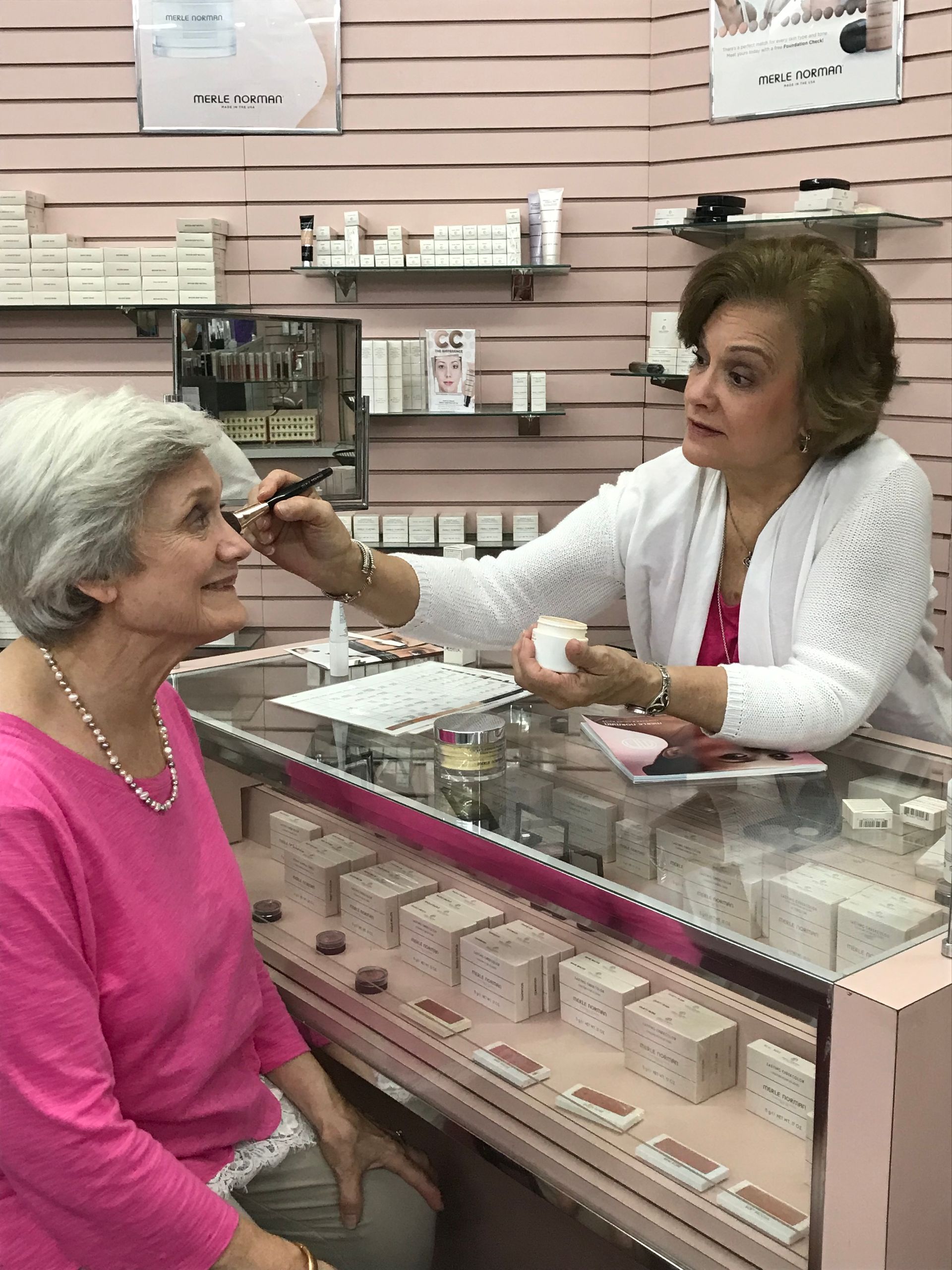 Makeup display featuring blush and lipsticks.