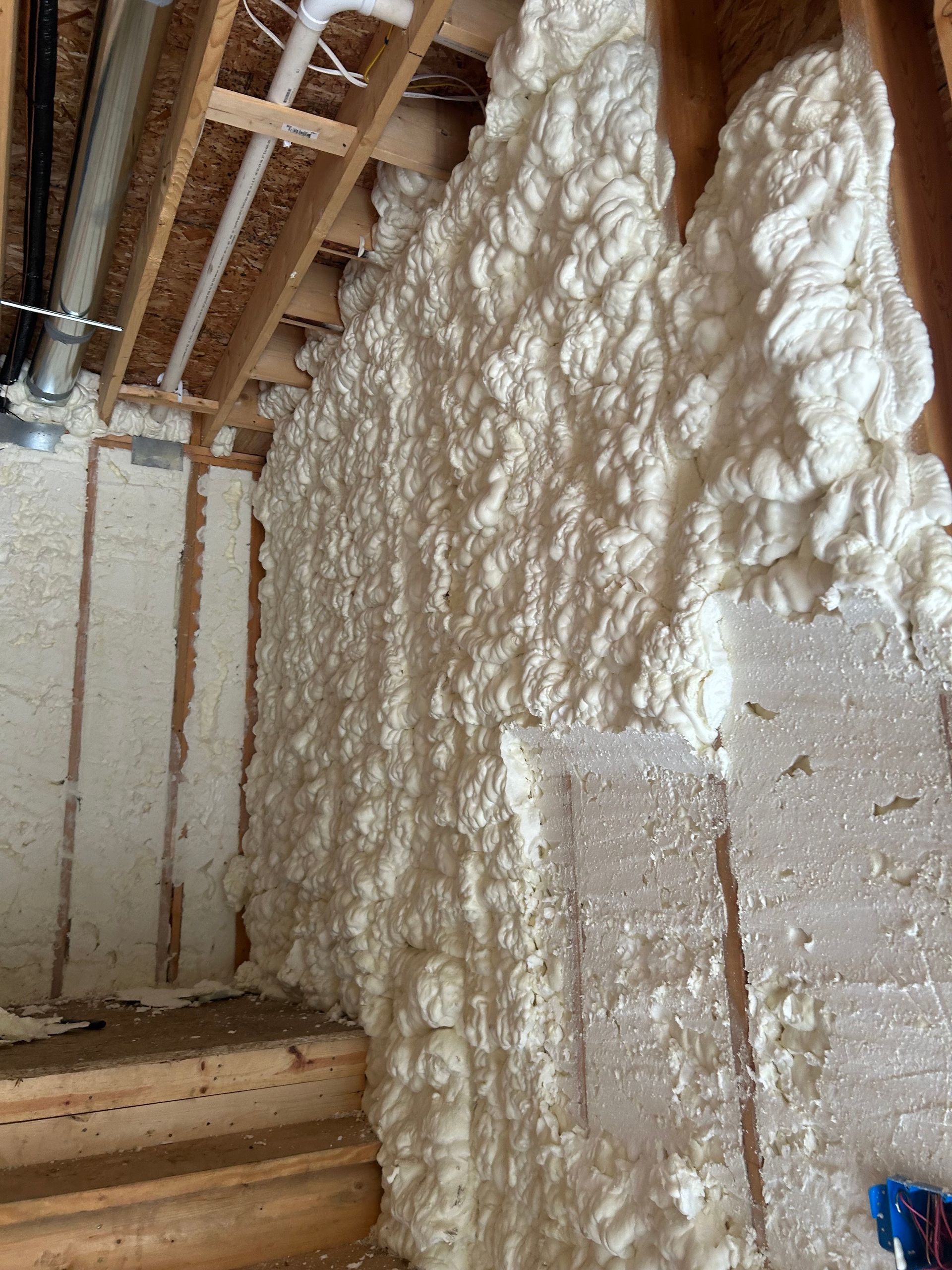 Spray foam insulation on interior basement walls.