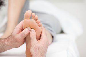 Massaging feet