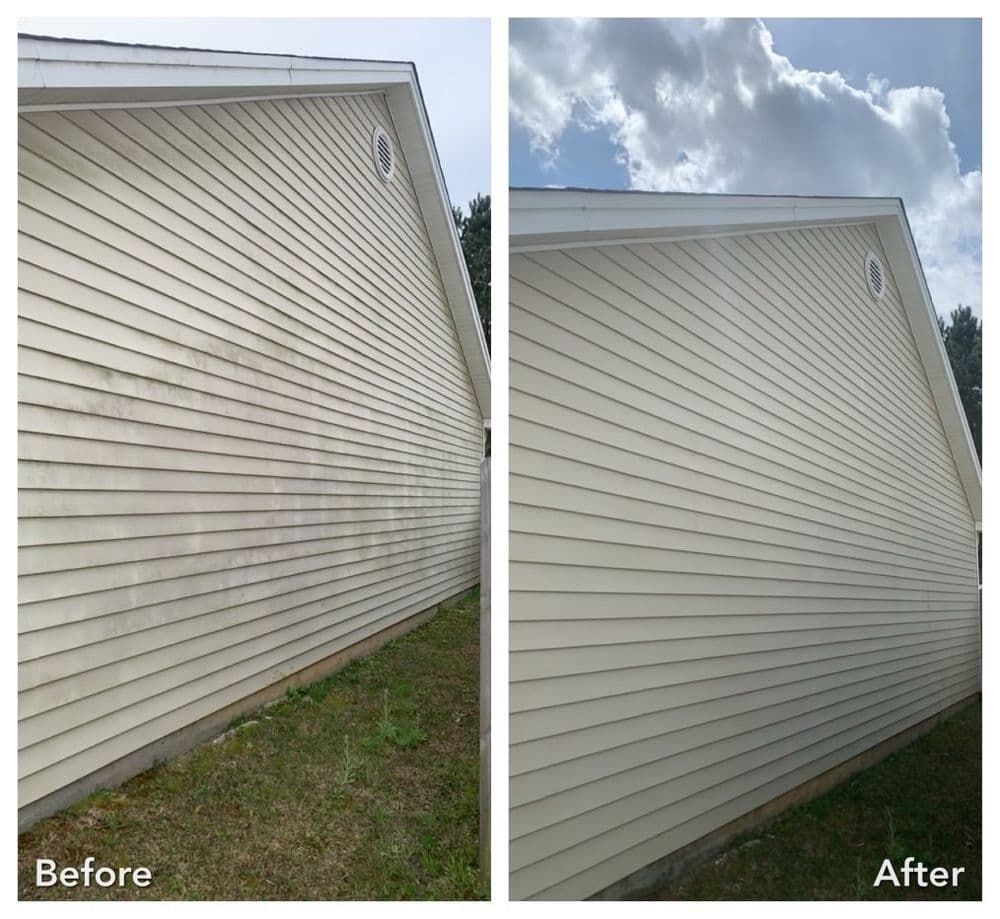 Siding of a house, before and after cleaning. Beige siding, white trim, grass below, and blue sky with clouds.