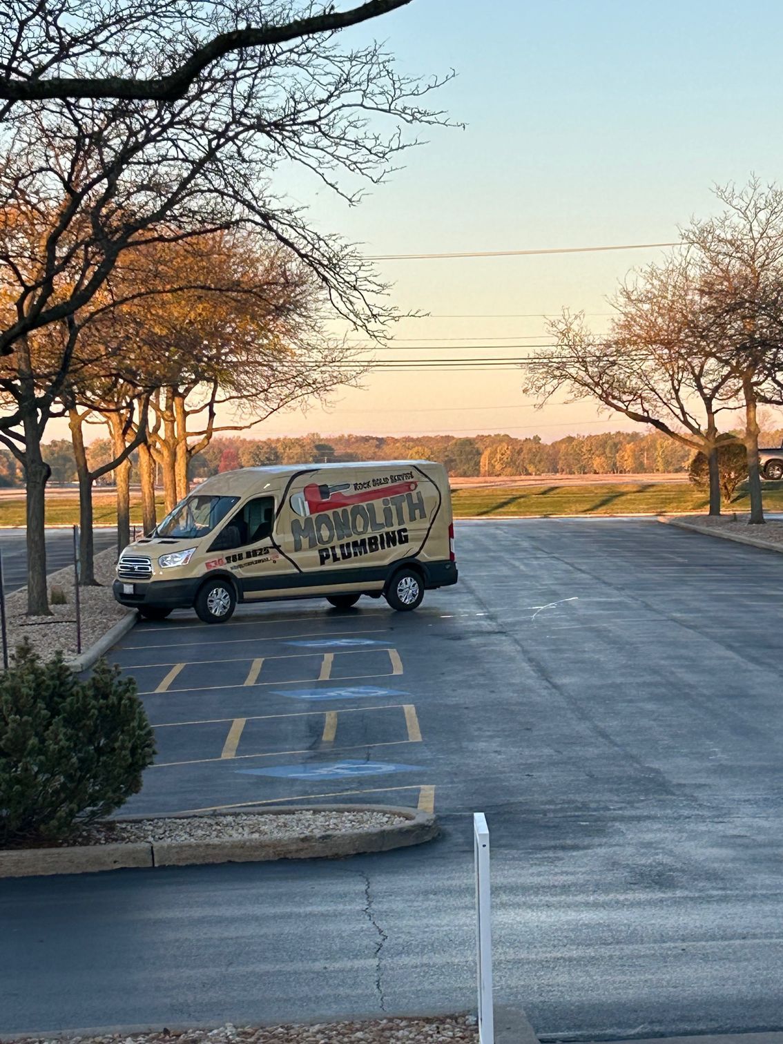 Orange and white striped traffic cones and barricade with 