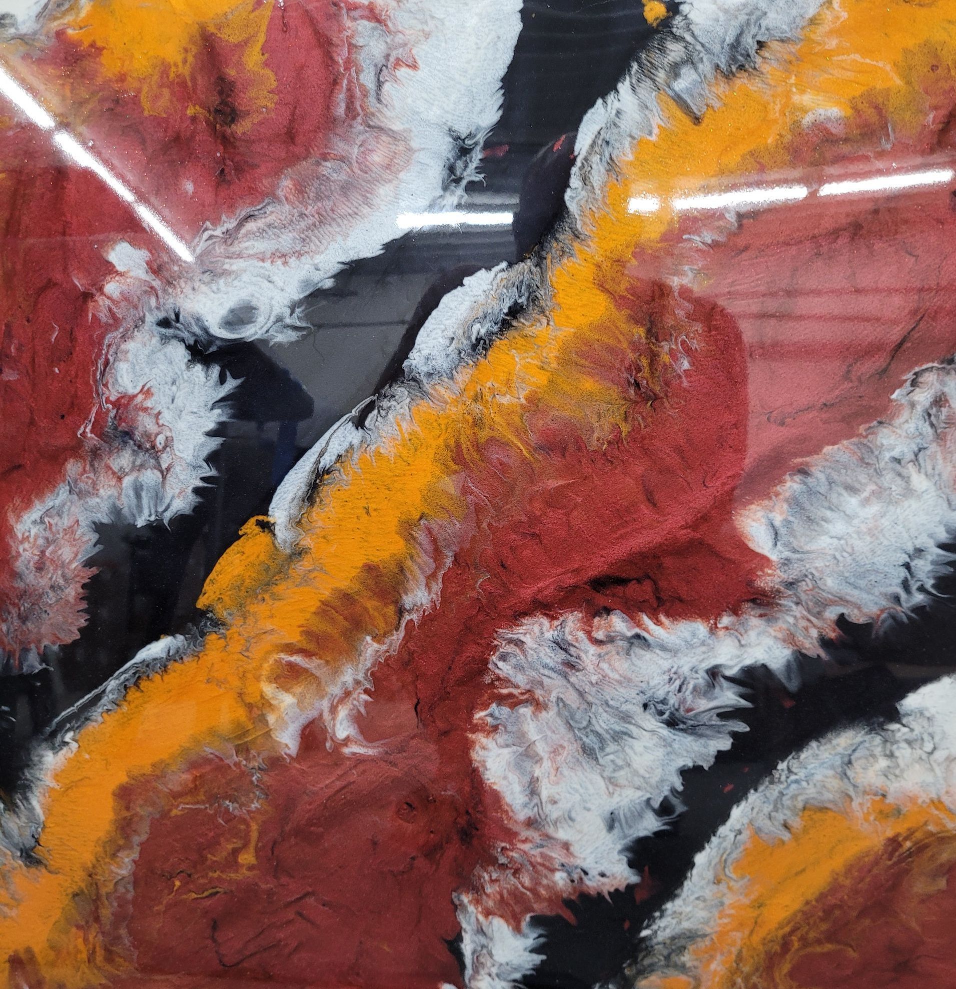 A close up of a painting with a lot of different colors