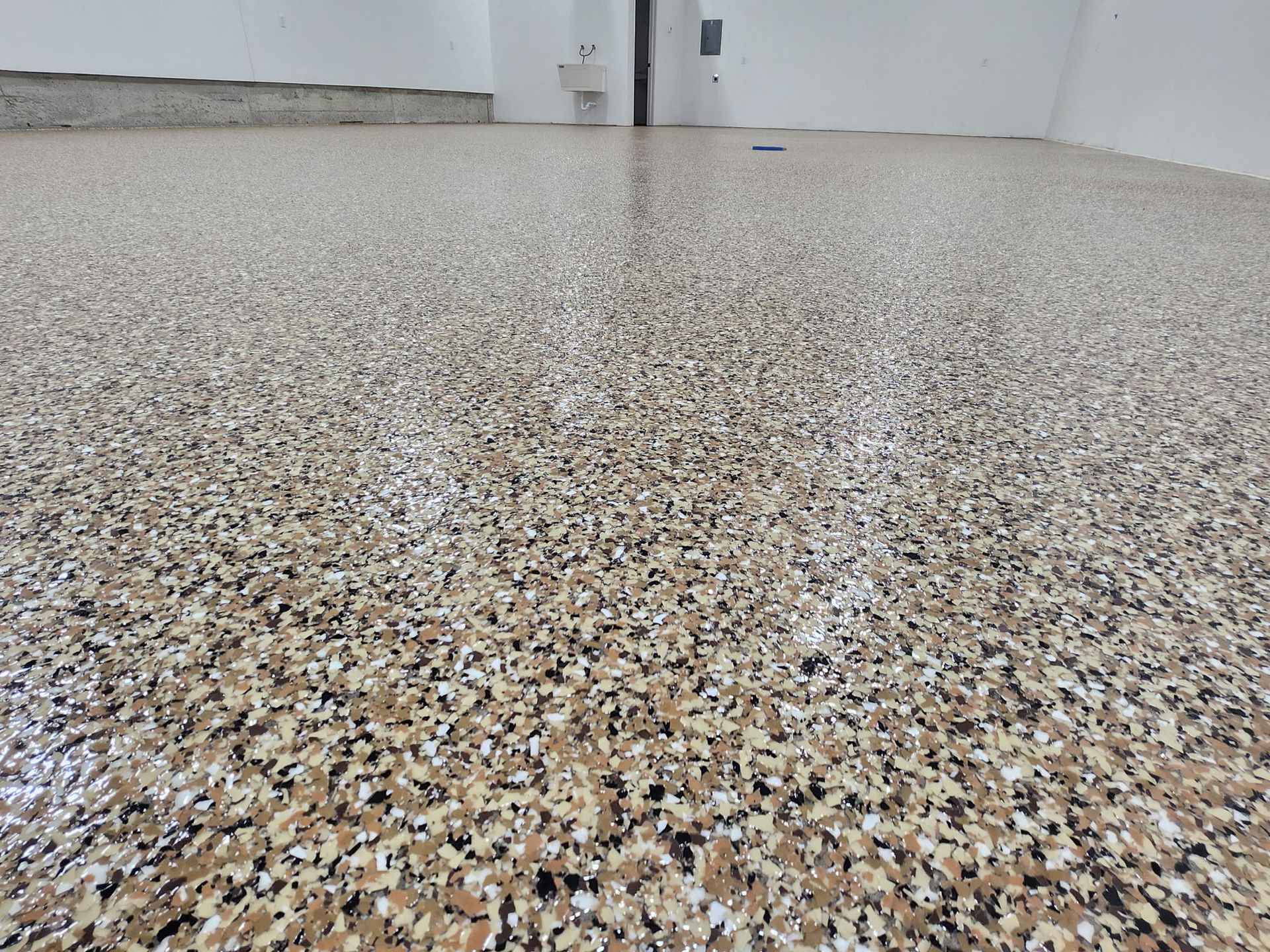 A close up of a concrete floor in a garage.