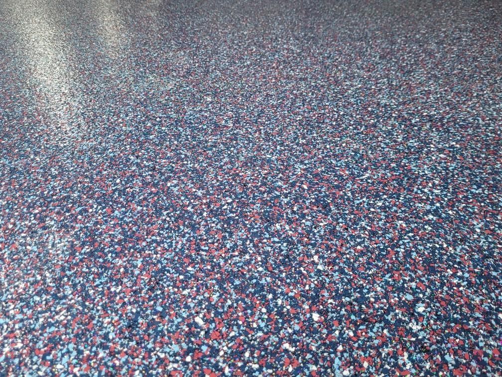 A close up of a red , white and blue colored floor.