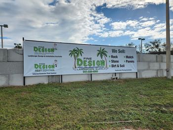 A large billboard that says fine design on it