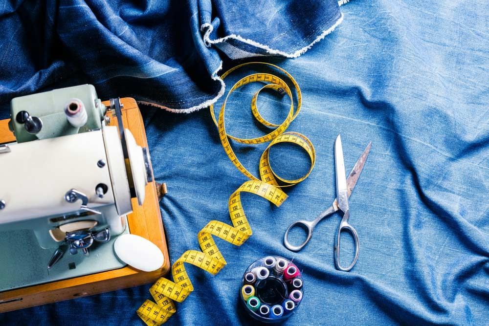 Sewing Indigo Denim Jeans With Sewing Machine — Sewing & Embroidery Fabric in Tamworth, NSW