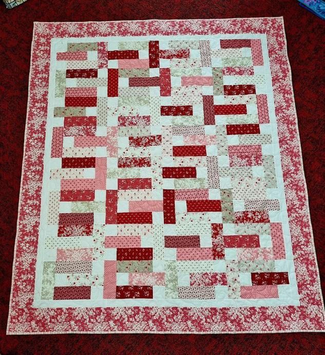 A Red and White Quilt With a Red Border — Stitch 2340 In Gunnedah, NSW