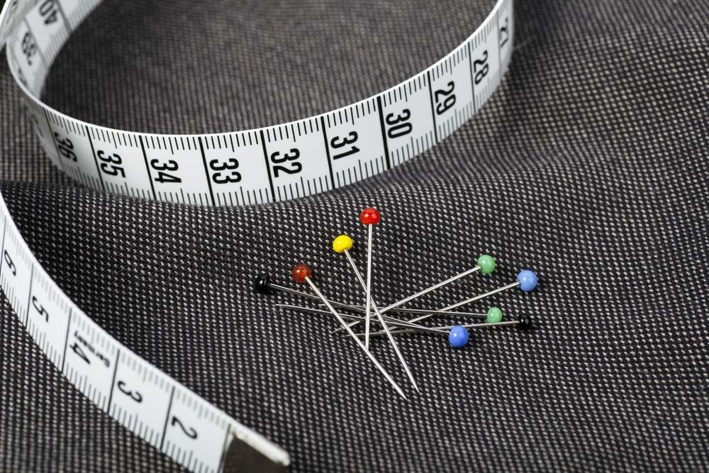 Pins And Measuring Tape On Fabric — Sewing & Embroidery Fabric in Dubbo, NSW
