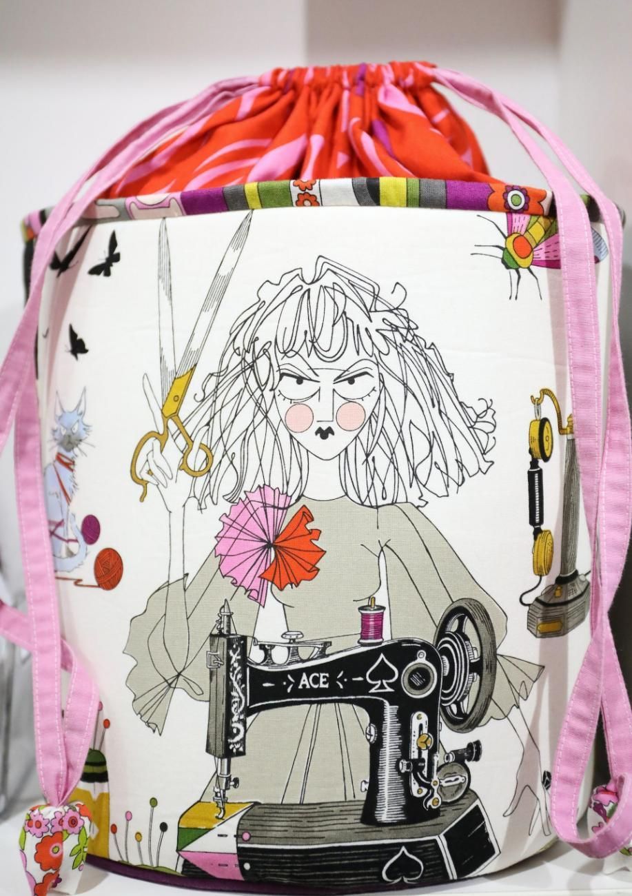 A Drawstring Bag with A Drawing of A Woman and A Sewing Machine — Stitch 2340 In Port Macquarie, NSW