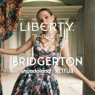 A Woman in A Floral Dress Is Standing in Front of A Curtain — Stitch 2340 In Tamworth, NSW