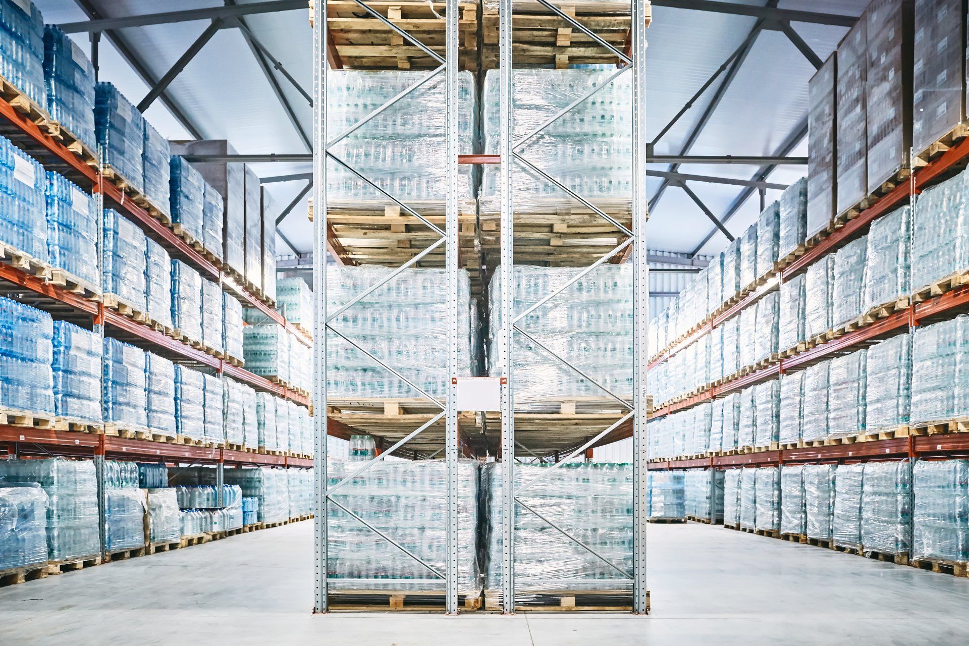 A large warehouse filled with lots of boxes and shelves.