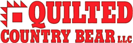 The logo for quilted country bear llc is red on a white background.