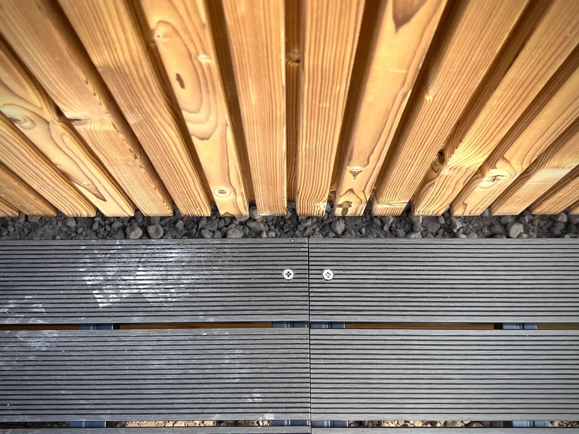 Wooden ceiling and gray plank flooring.