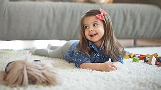 Child playing on carpet — carpet cleaning in Escondido, CA