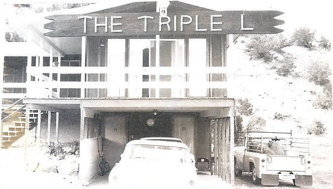 a black and white photo of the triple l