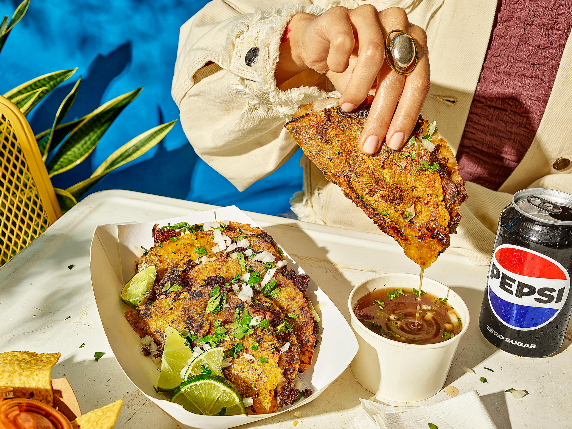 Food Service button – person dipping tacos into sauce