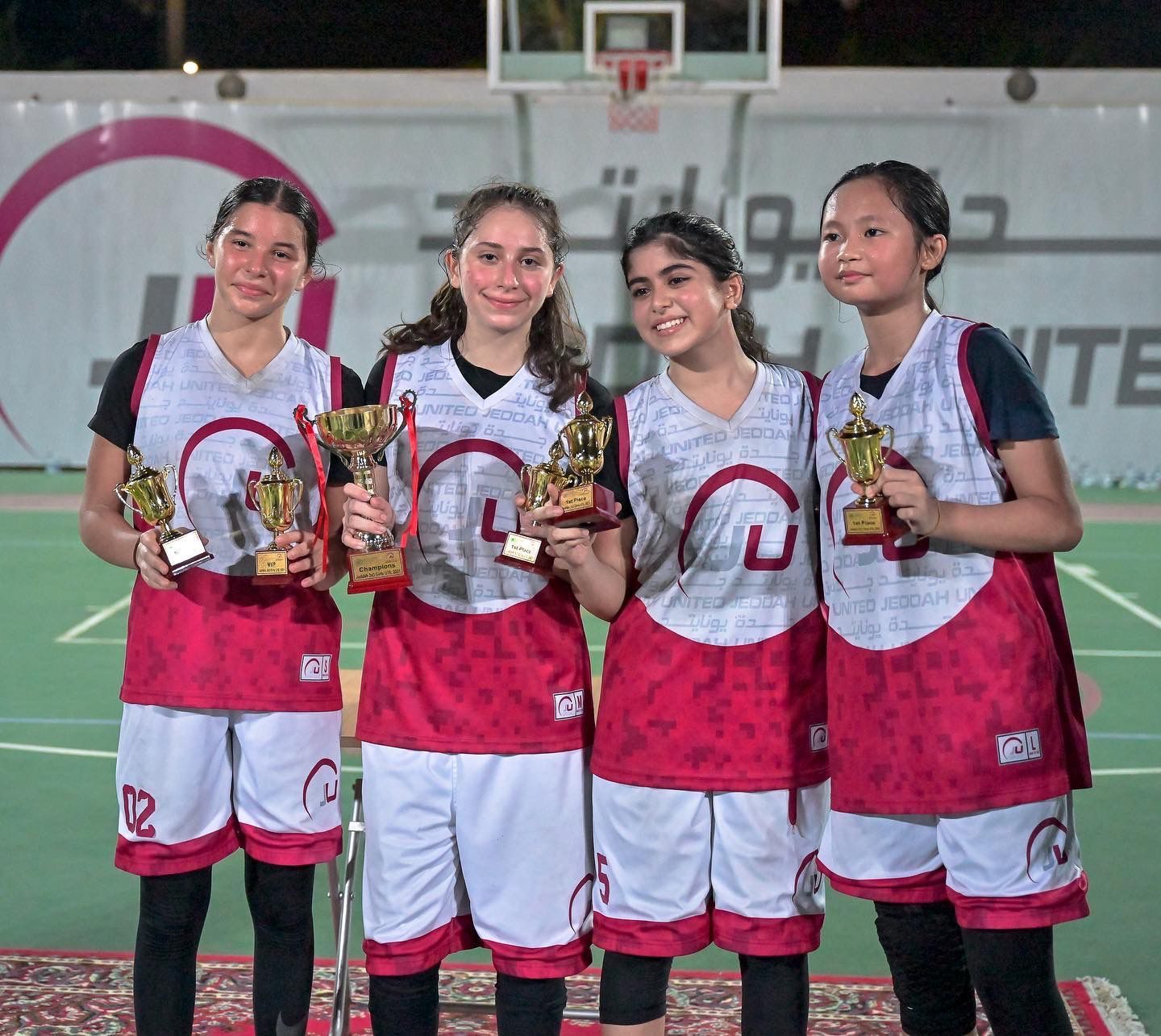 JU Baskeball girls team winning an award