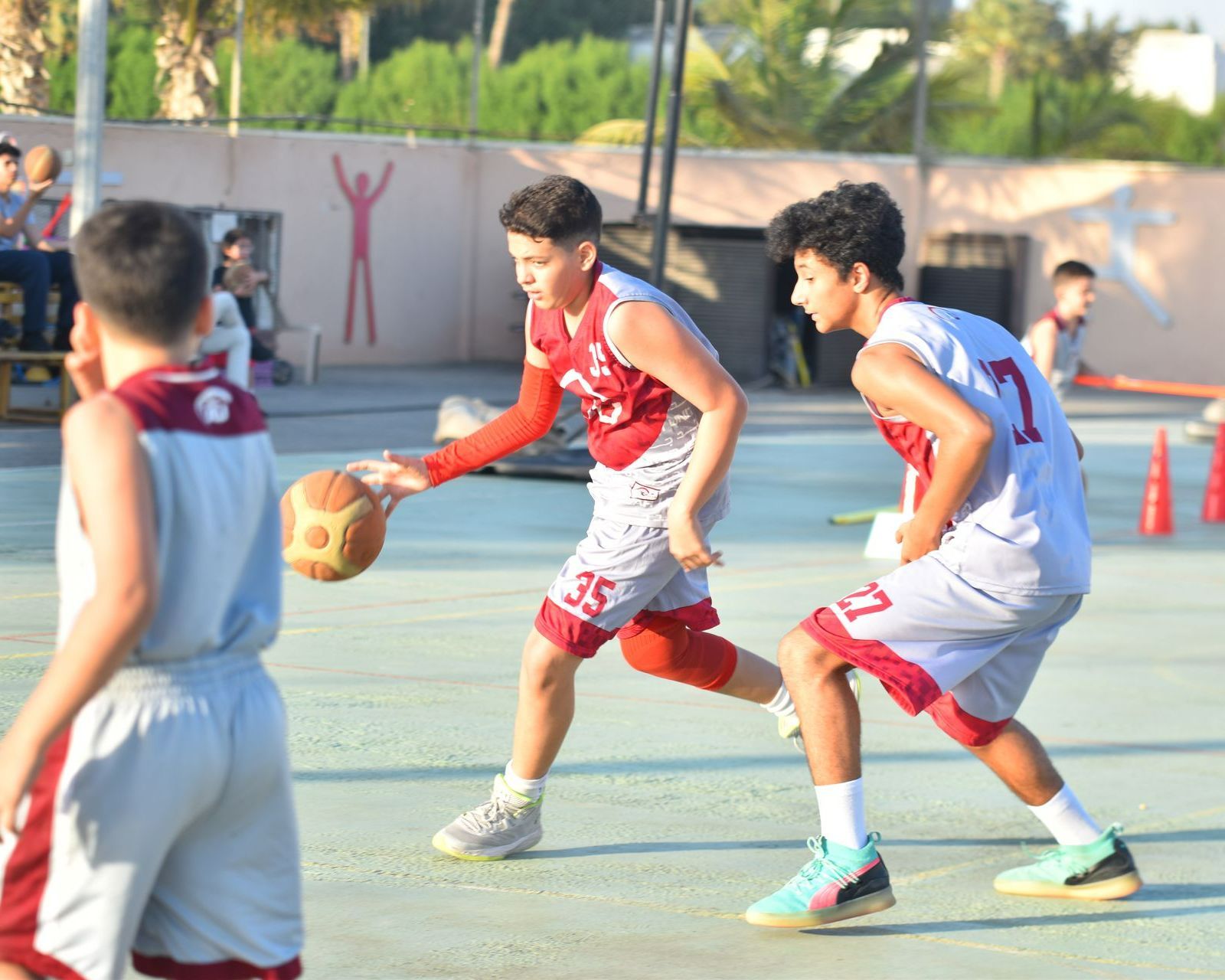 JU boys playing basketball