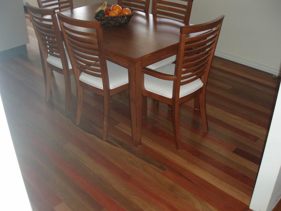 A Dining Room Table With a Bowl of Fruit on It — Timberfection Queensland in Yatala, QLD