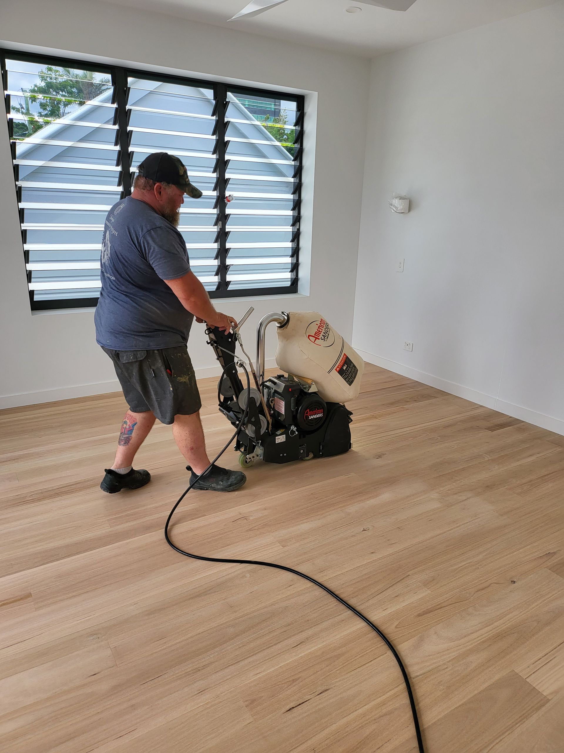 A Room With Wooden Floors and a Neon Sign That Says 'i Love You' on It — Timberfection Queensland in Yatala, QLD