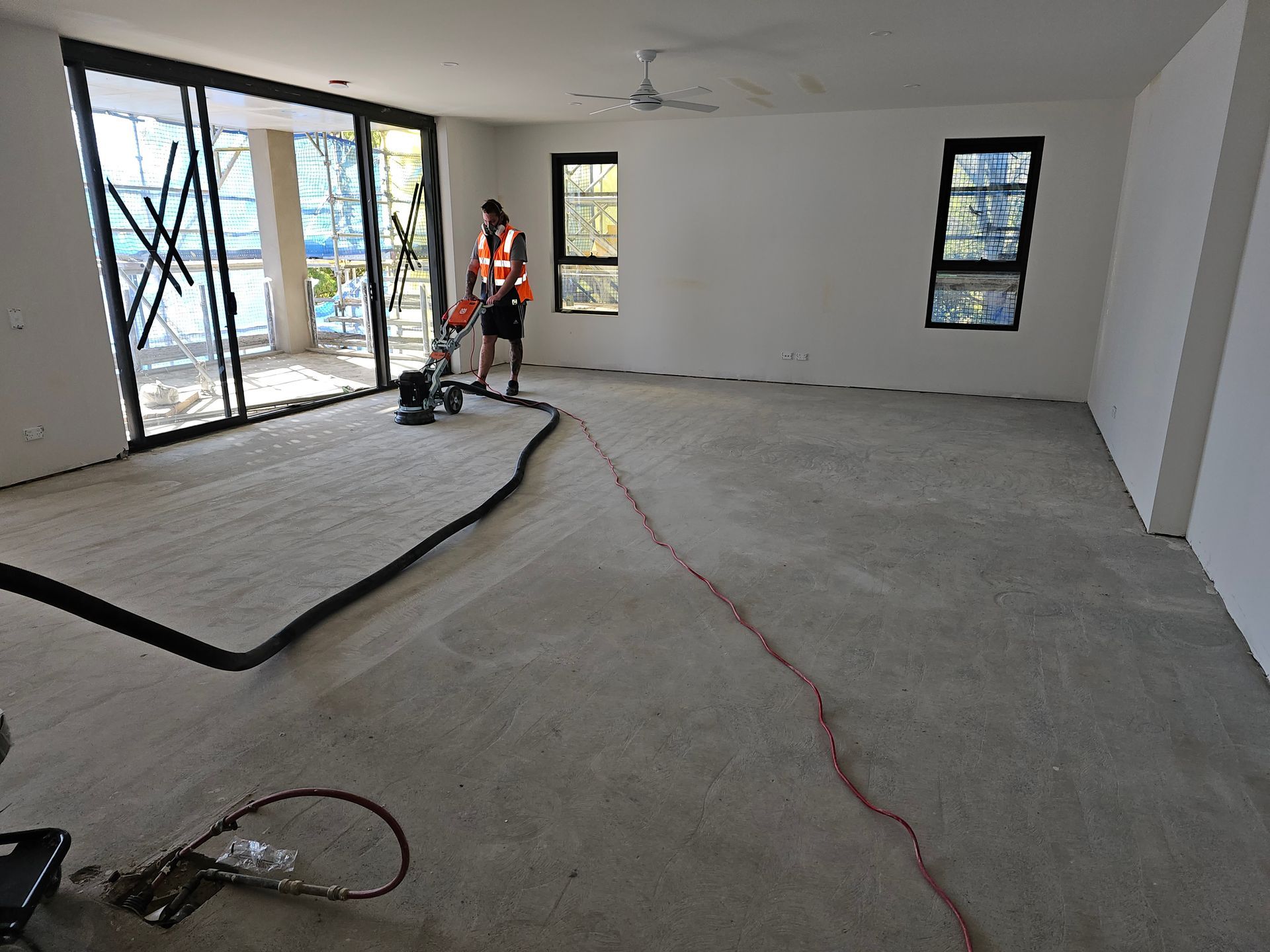 A Large Room With a Wooden Floor and a Lot of Windows — Timberfection Queensland in Yatala, QLD