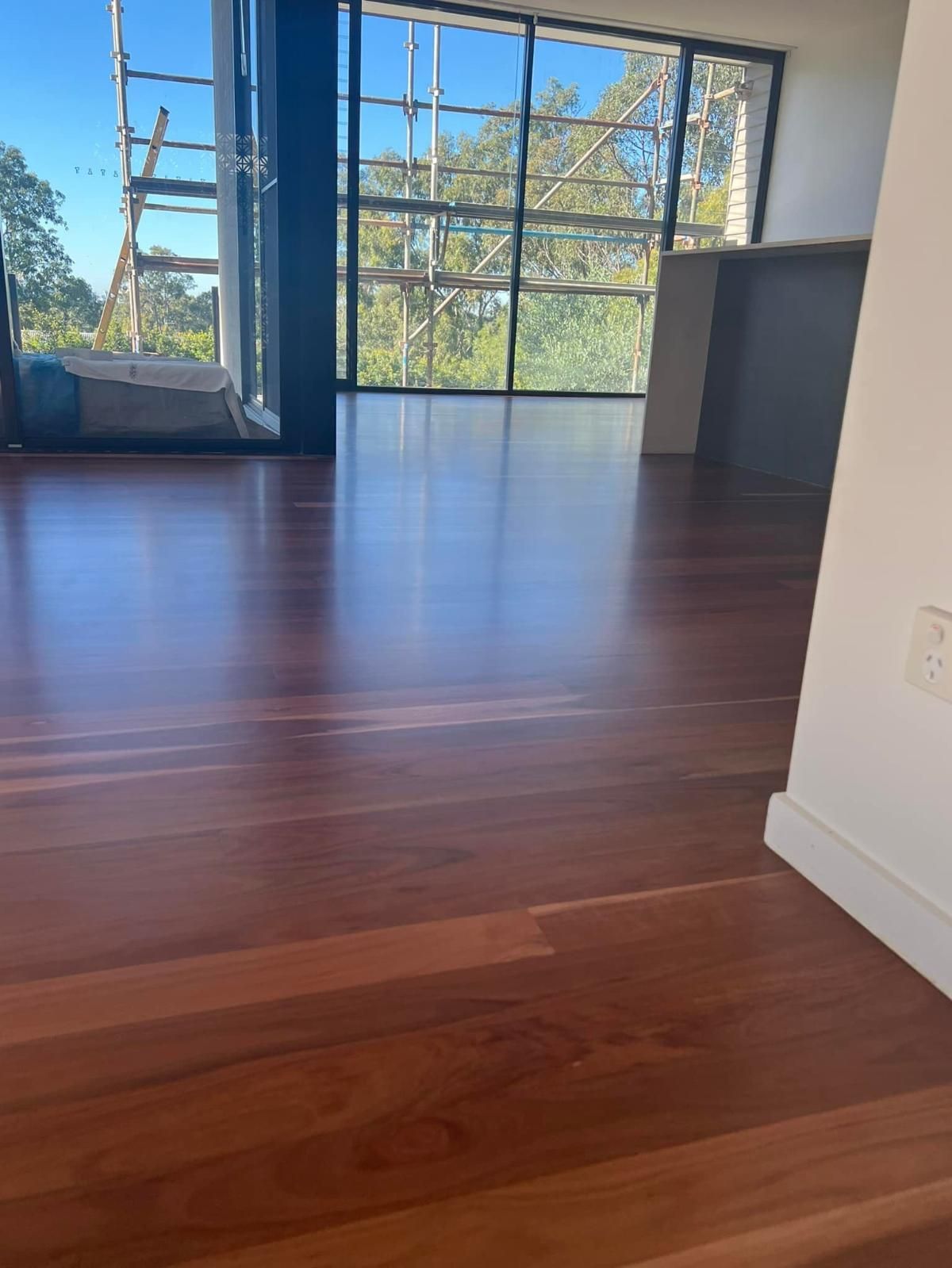 A Room With a Wooden Floor and a Lot of Windows — Timberfection Queensland in Yatala, QLD