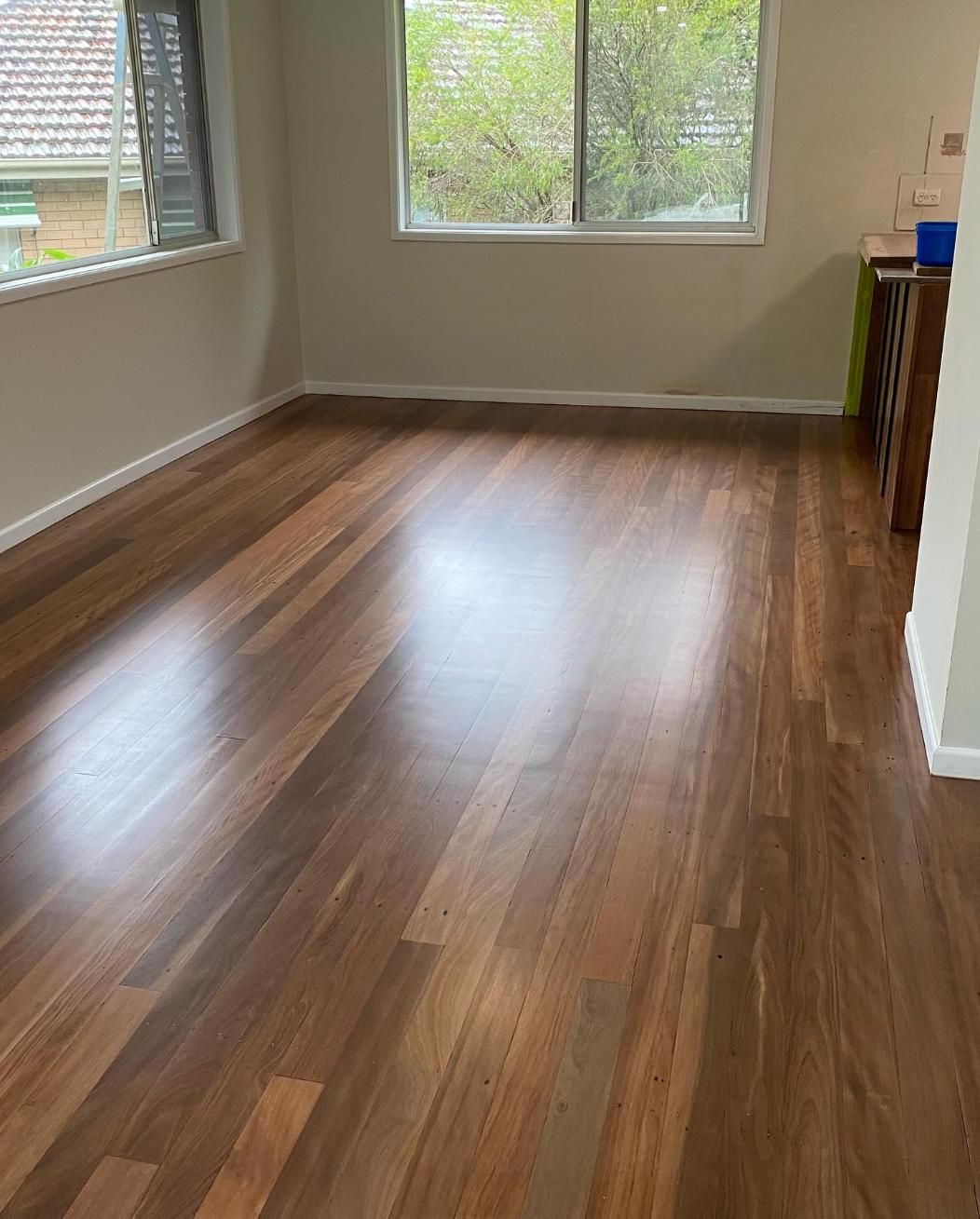 A Room With a Wooden Floor and a White Wall — Timberfection Queensland in Yatala, QLD