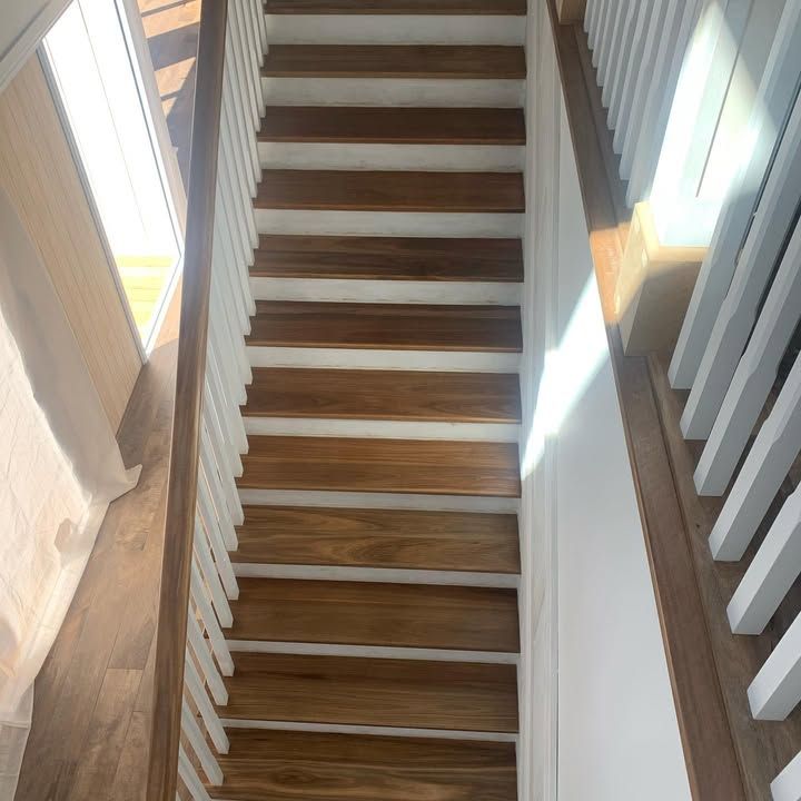 A Staircase With Wooden Steps and White Railing in a House — Timberfection Queensland in Yatala, QLD