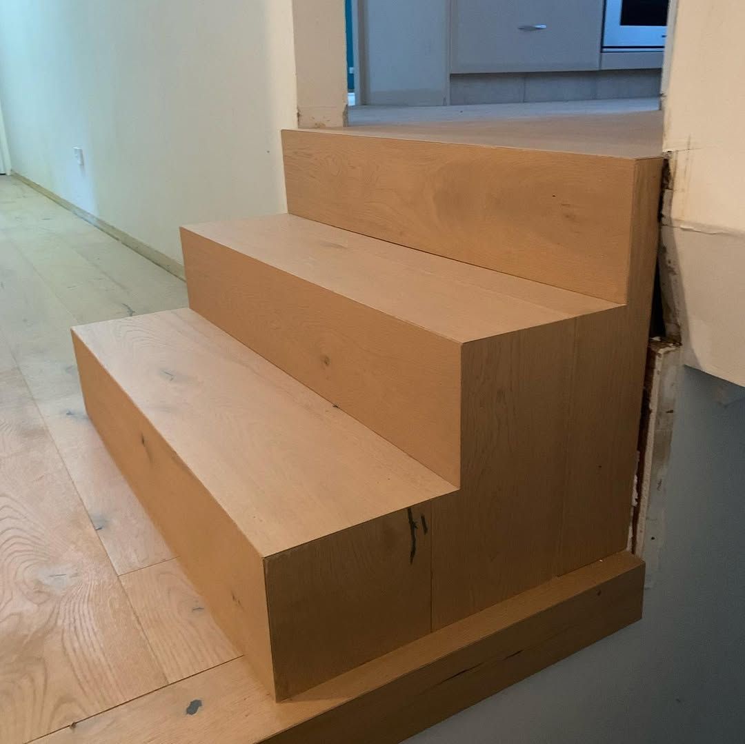 A Set of Wooden Stairs Sitting on Top of a Wooden Floor — Timberfection Queensland in Yatala, QLD