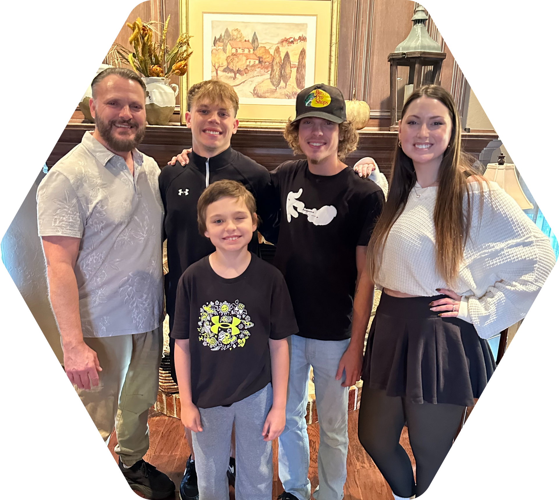 A man is holding a wrench and giving a thumbs up.