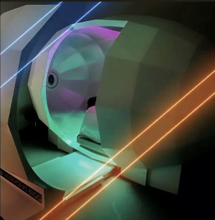 A futuristic device with a purple light coming out of it