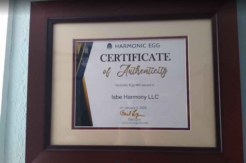 A certificate of authenticity is framed on a wall