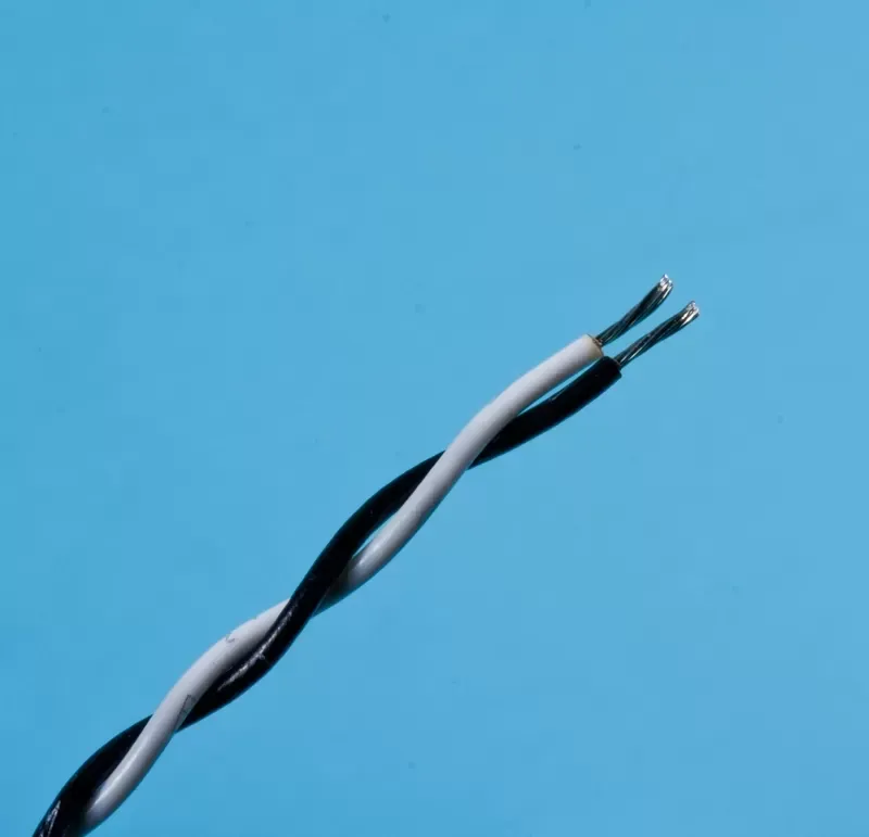A black wire and a white wire twisted together against a blue background, showing stripped, metallic ends.