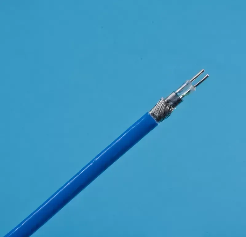 A close-up view of a blue, shielded electrical cable with two exposed metal wire conductors at the tip.