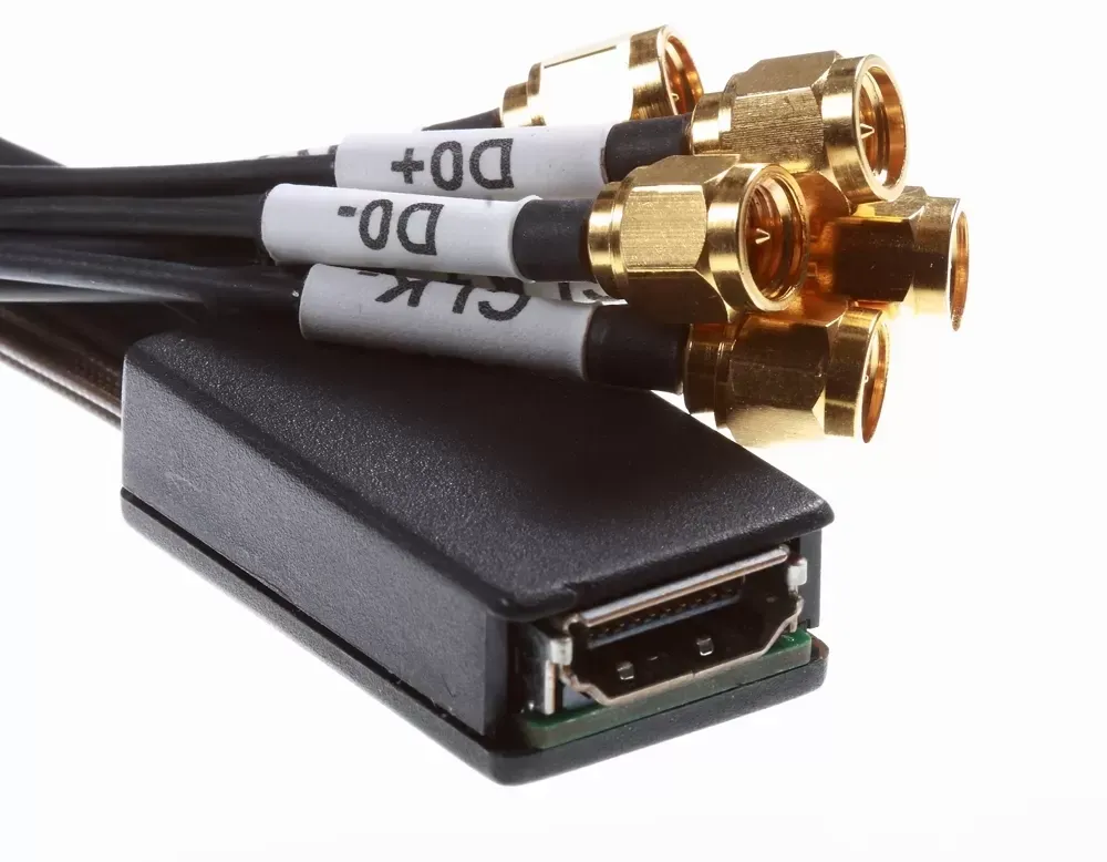 A DisplayPort breakout adapter with five labeled coaxial cables ending in gold SMA connectors.